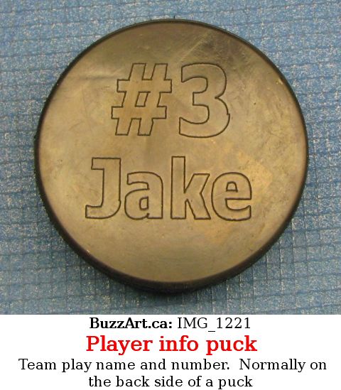 Team play name and number.  Normally on the back side of a puck